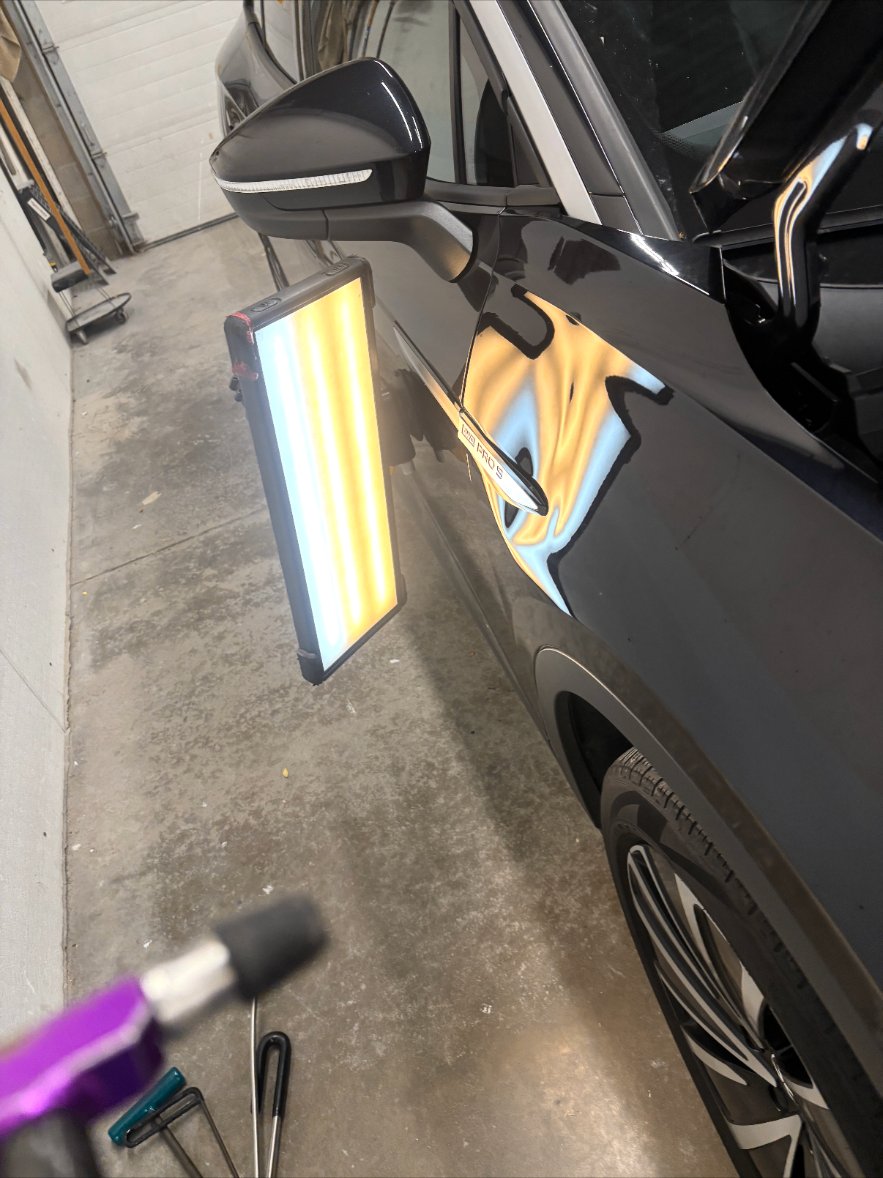 Rear door — black SUV before repair