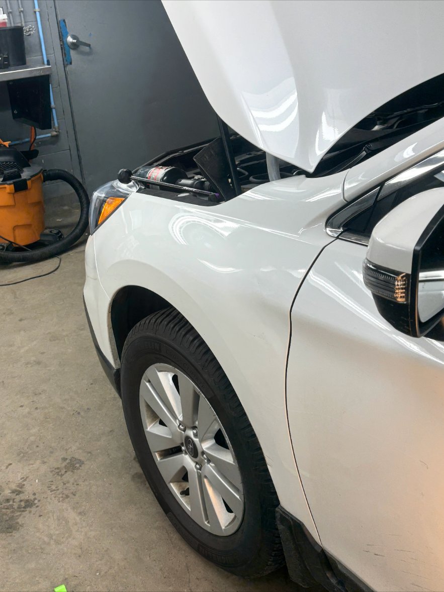 Front left fender — SUV after repair